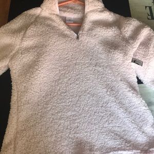 A pink colored fleece pullover sweater for women